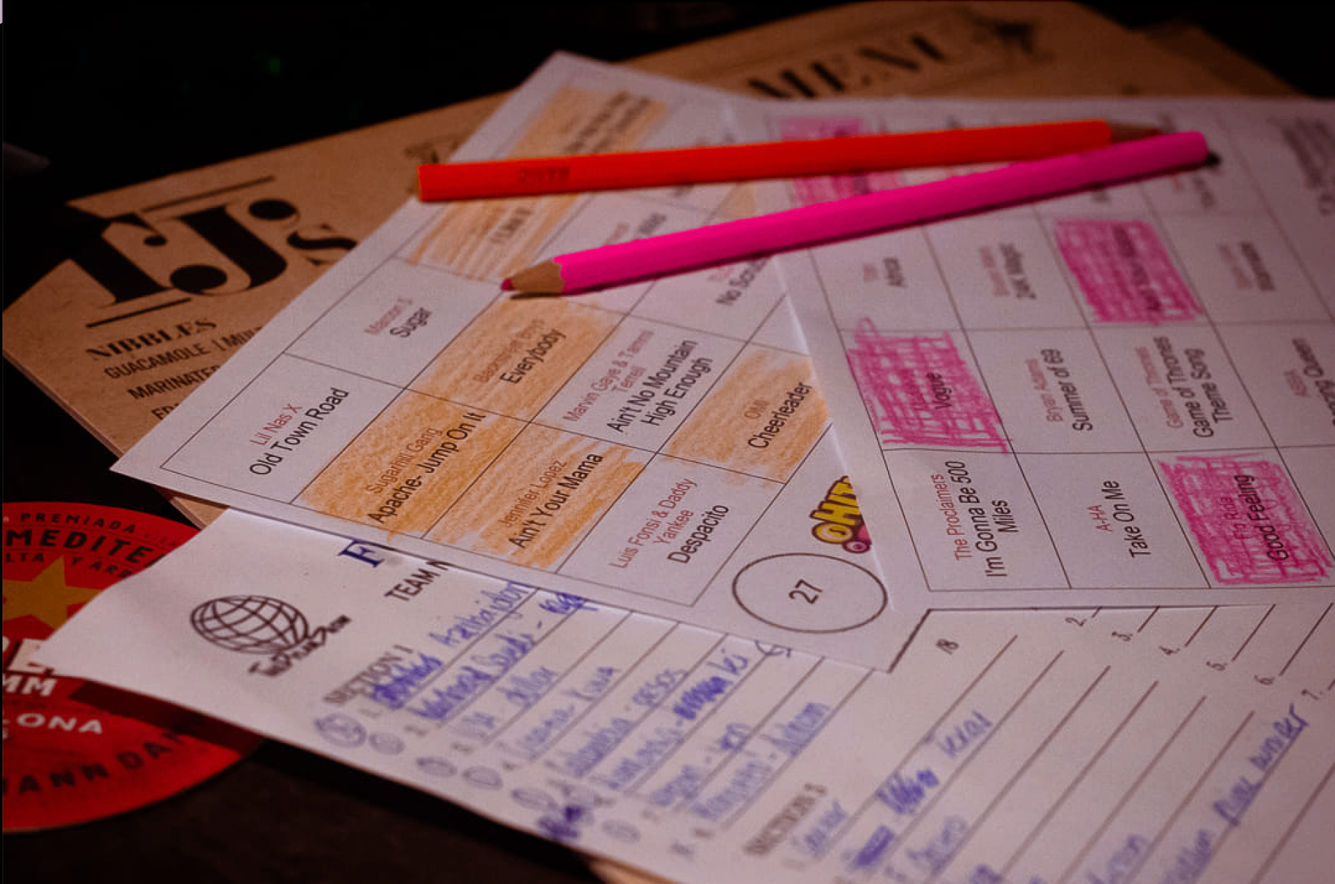 A HitMix music bingo card on a pub table